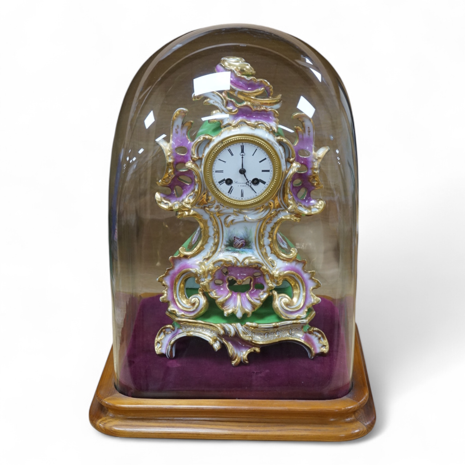 A 19th century French porcelain mantel clock, under dome by Steinman Paris, dome 45cm high. Condition - good
